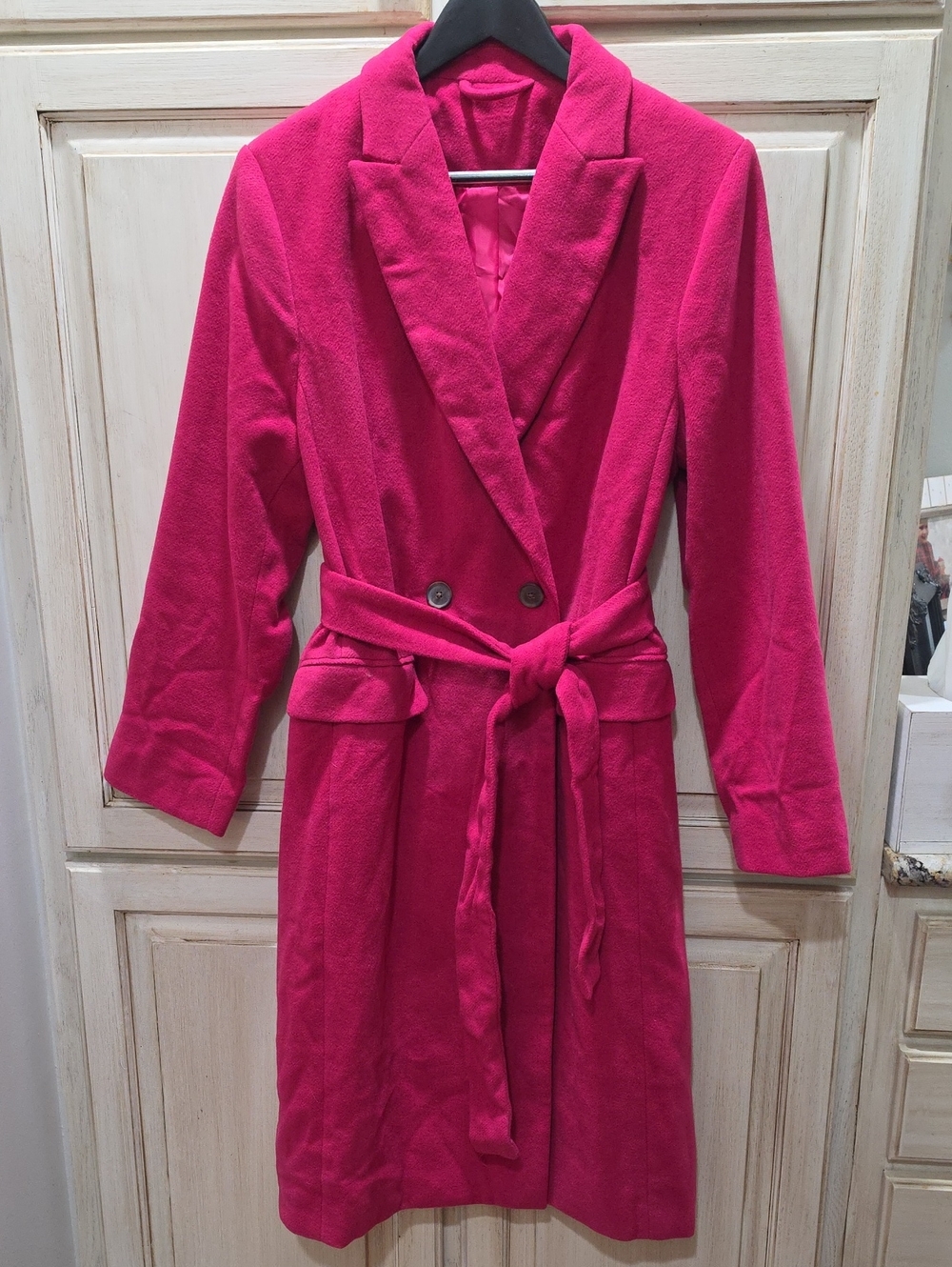 Fuchsia pink long coat features a clean single-button front closure. NWOT